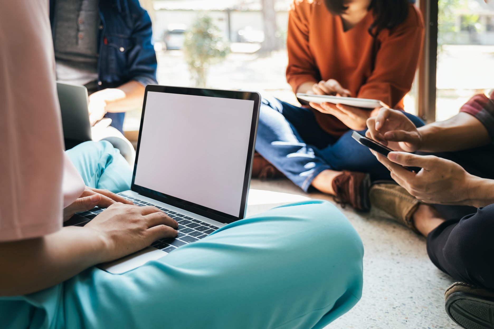 Teen Group Using Computer and Tablet  